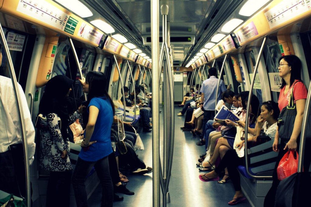 Singaporean commuters ride the MRT in this image. As most residents can't afford to own a car some expats might not enjoy public transport 